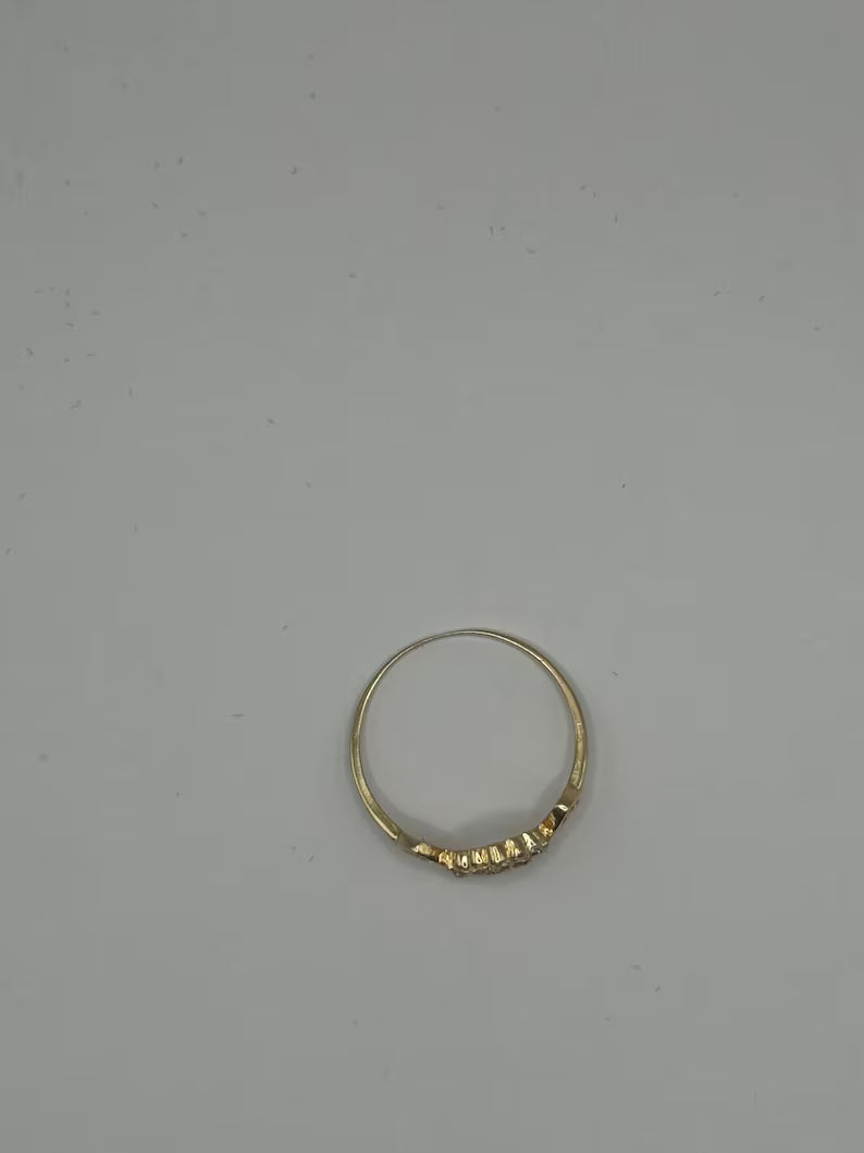 Gold ring on a gray background